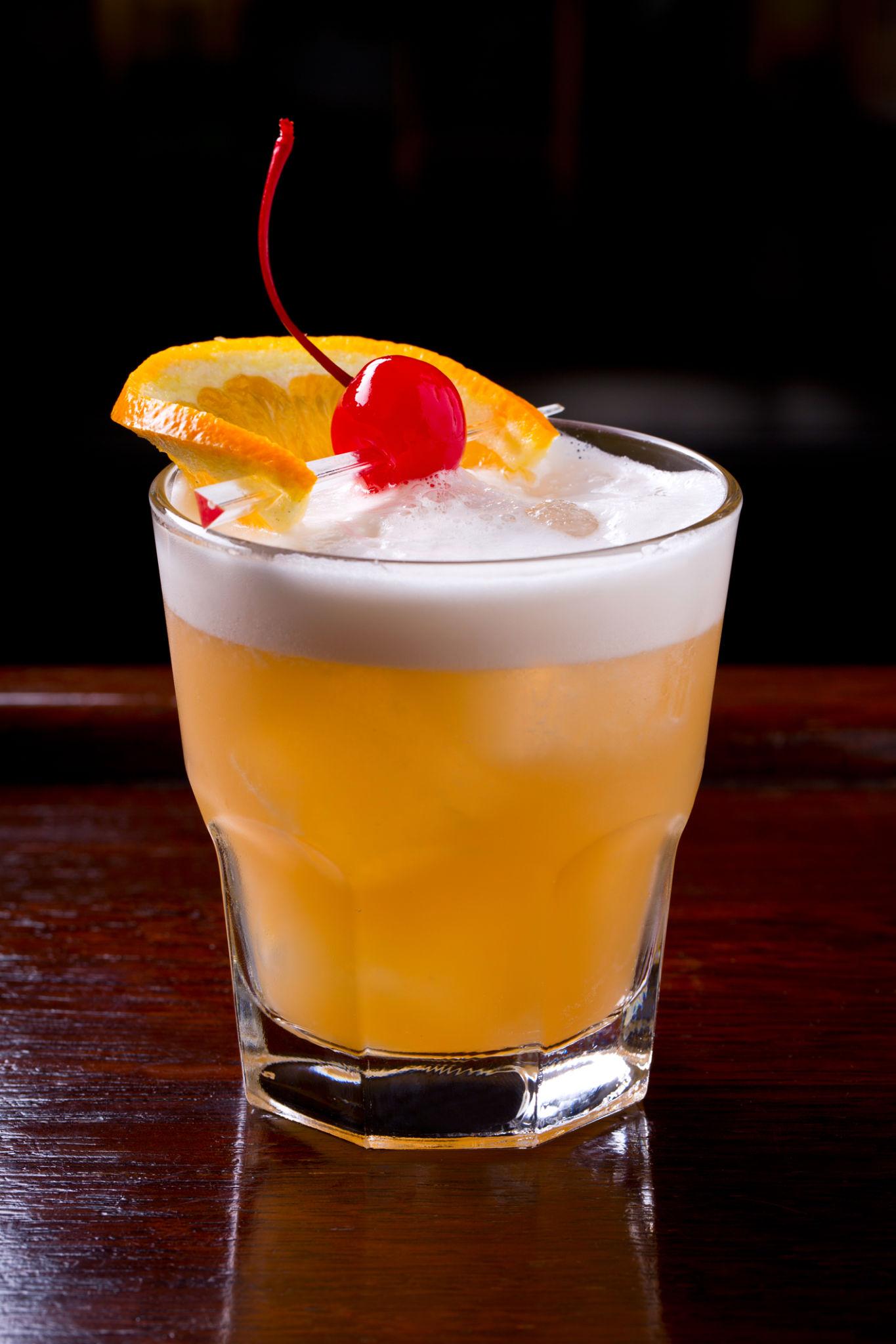 Whisky cocktail being mixed with ice